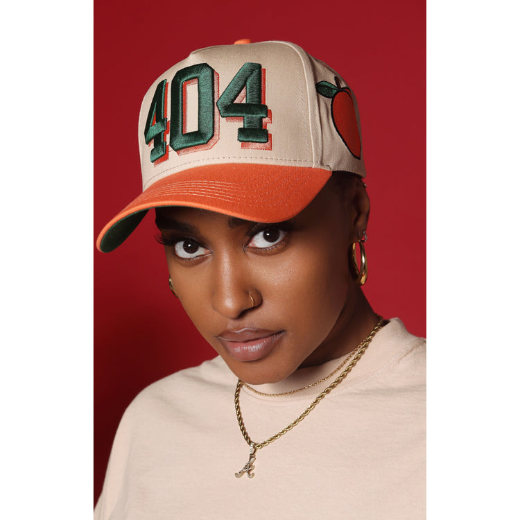 404-hat-peach-on-model_750x.